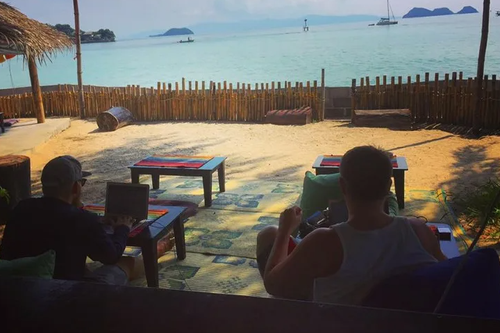Remote teams collaborating near the sea