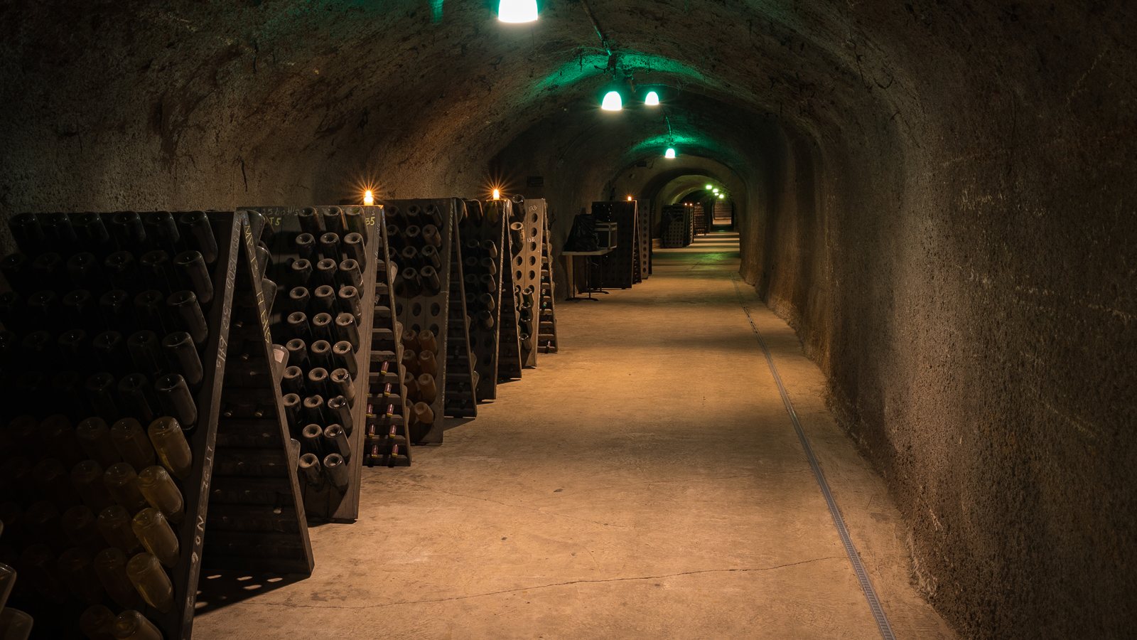 Stone-walled cellar filled with aging bottles
