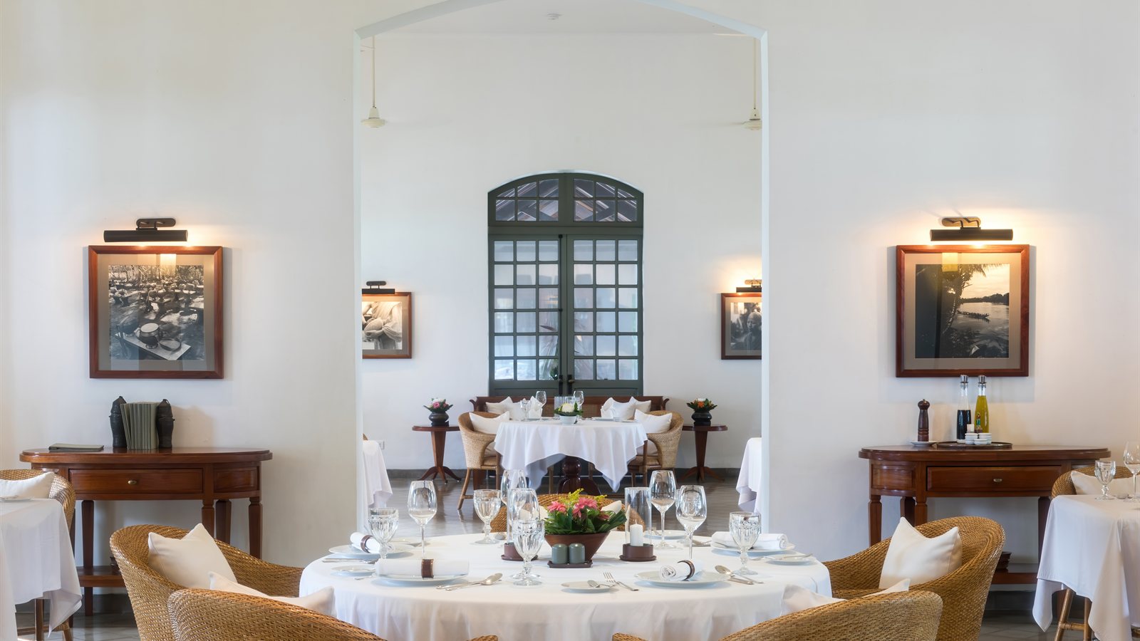 Table laid with linen and cutlery ready for service