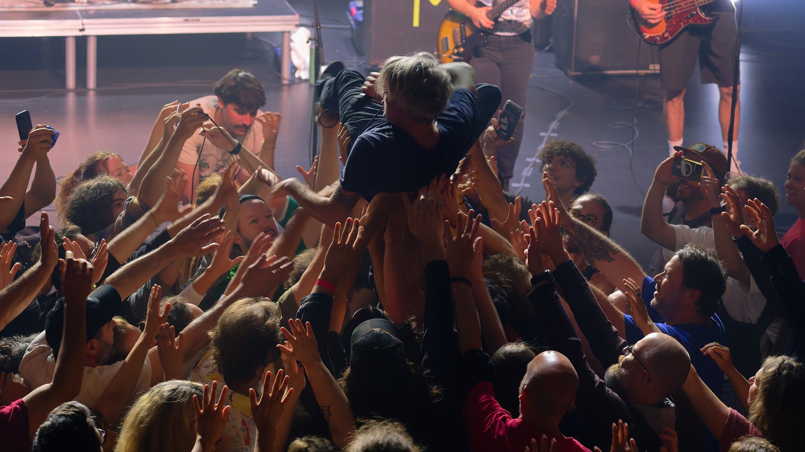 Audience watching a band at an outdoor festival