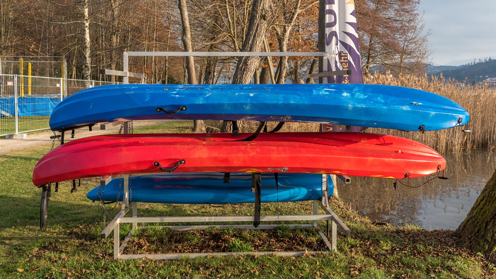 Surfboards stacked on a wooden storage rack