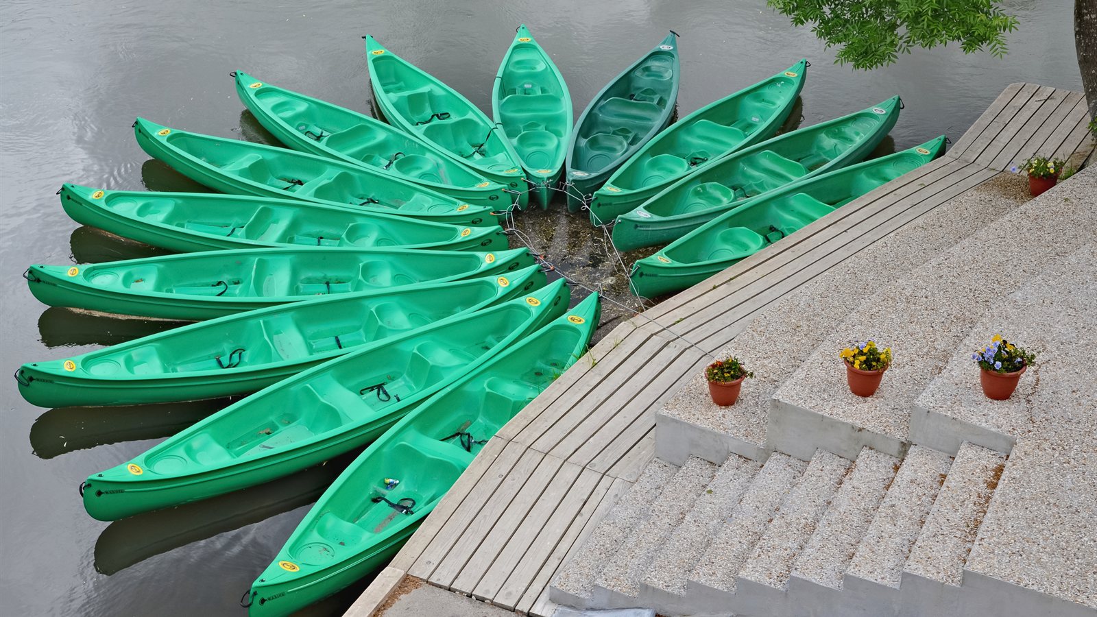 Canoe and kayak club building beside a quiet river