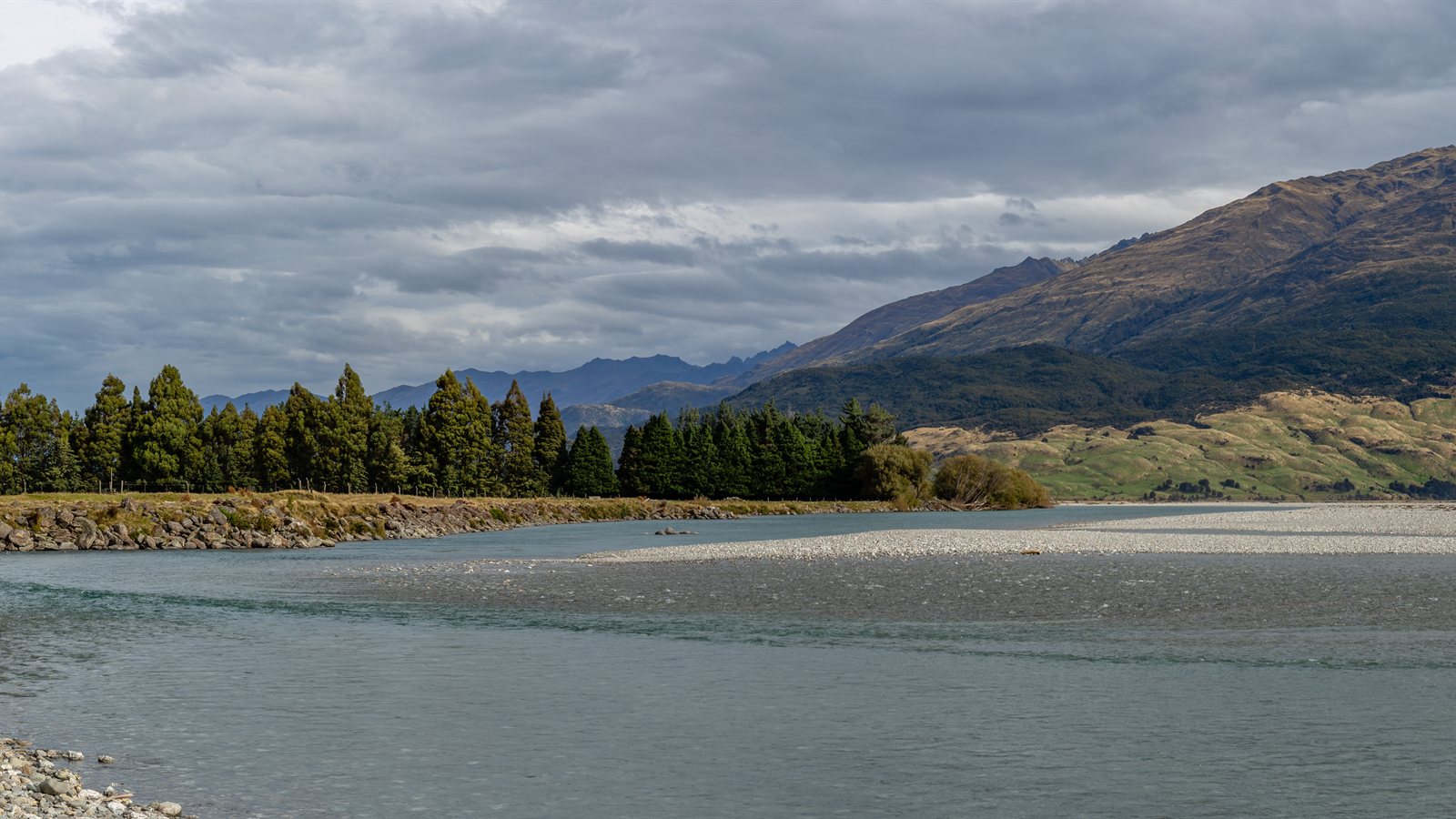 Braided river running through a broad mountain valley