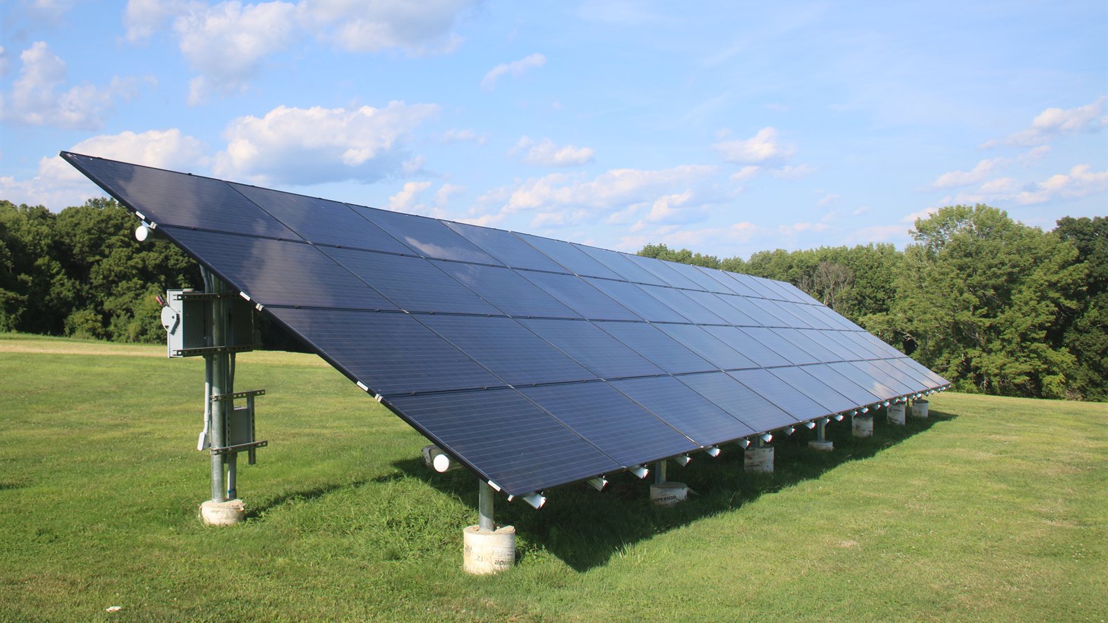 Ground-mounted solar panel row