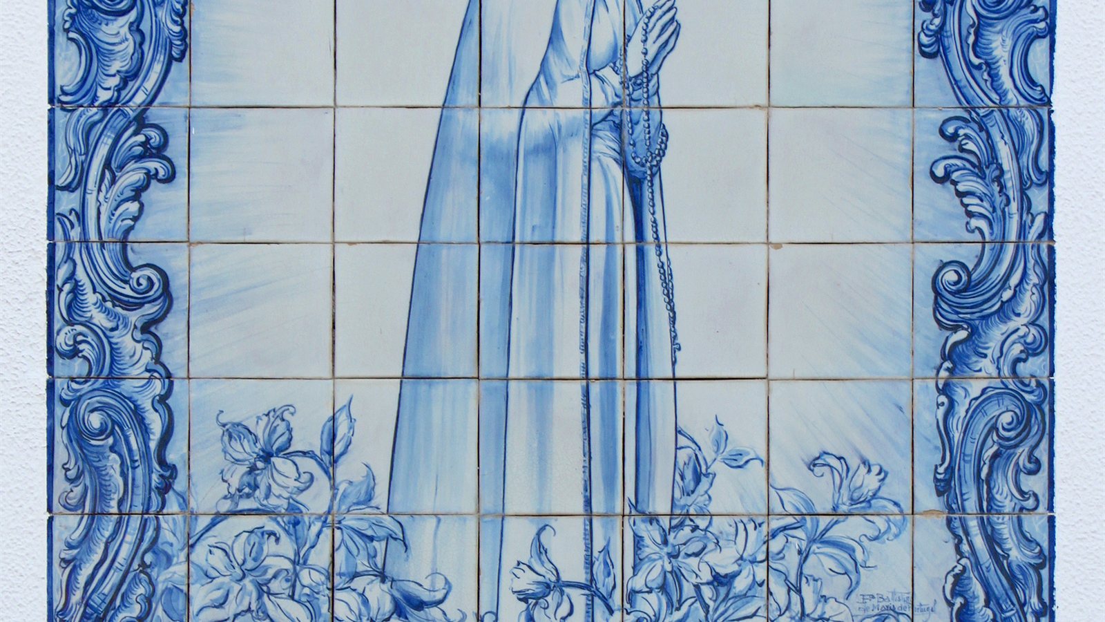 Historic blue and white tile panel on a church wall