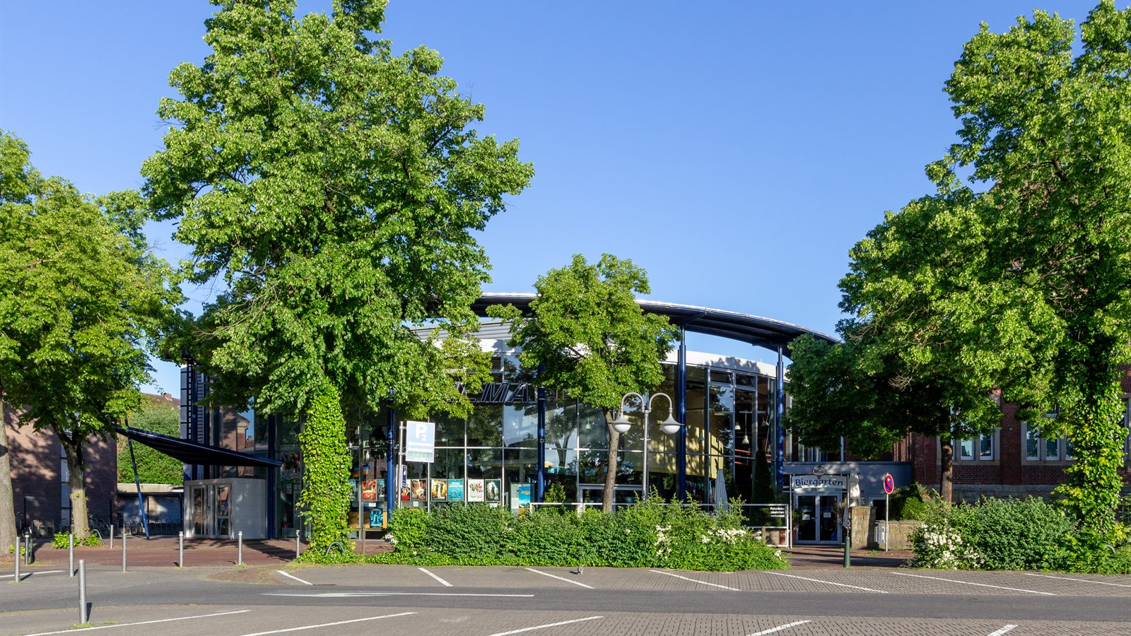 Empty marked car park in front of a commercial building