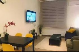 Serviced apartment bedroom with bright modern design