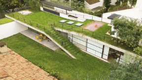 Terrace seating among greenery on a rooftop
