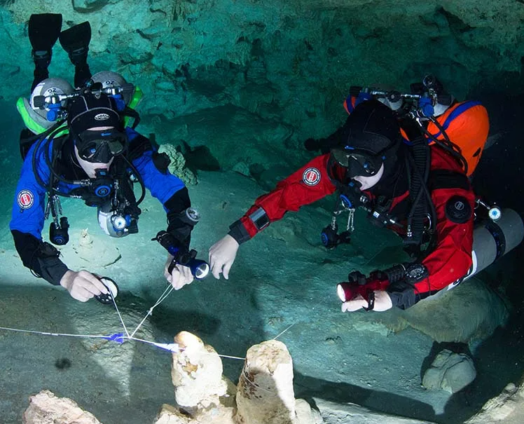 Technical diving equipment laid out and prepared on a quayside